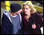 Jimmy (Eminem) and Alex (Brittany Murphy) both plan to break through the boundaries that have shaped their lives in "8 Mile"