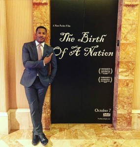 Nate Parker with The Birth of a Nation poster